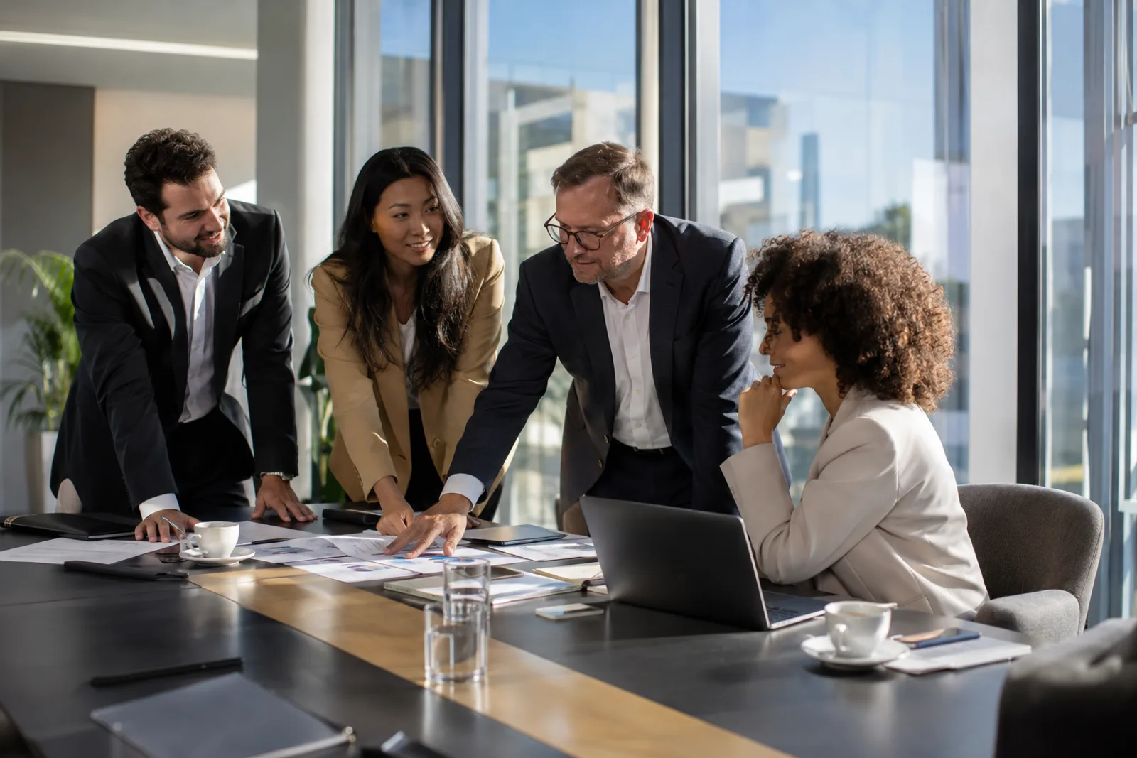Consulting team discussing a project around a table
